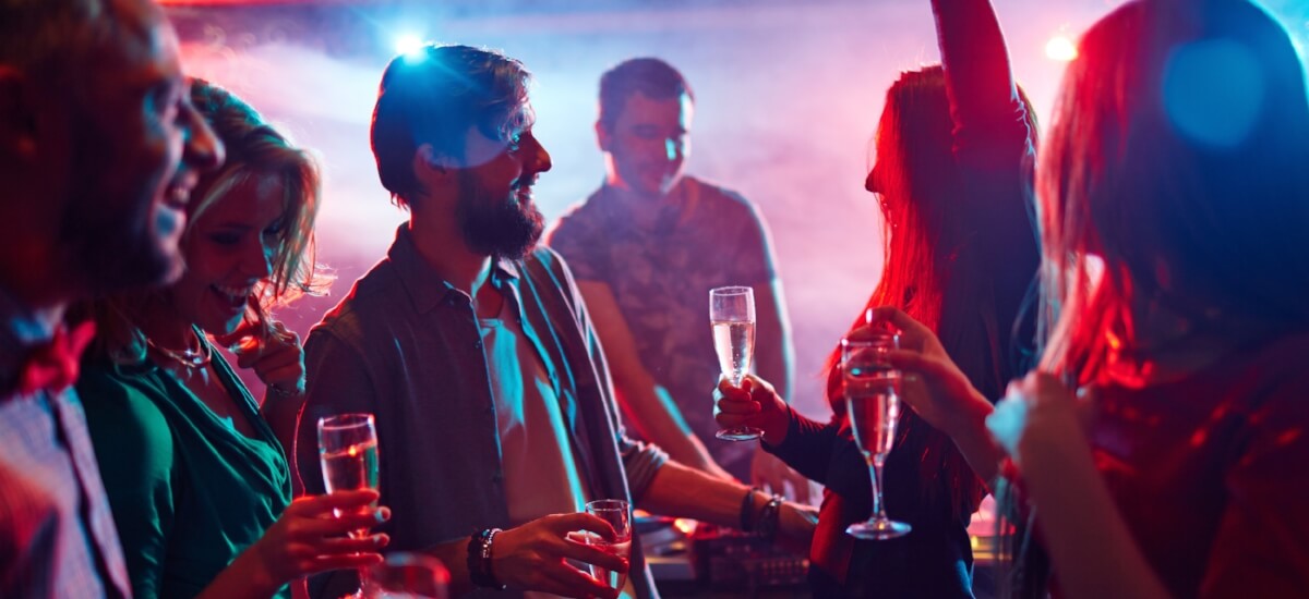 People drinking champagne at a night club